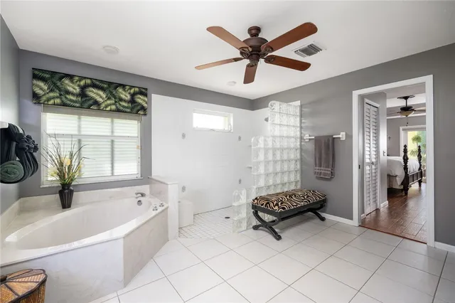 a living room with a bed and a chandelier