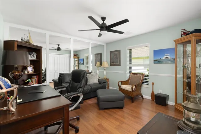 a living room with furniture a air conditioner and a window