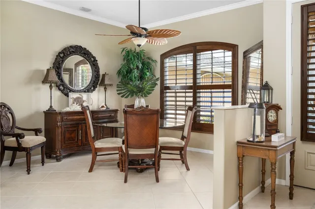a view of a dining room with furniture window and outside view
