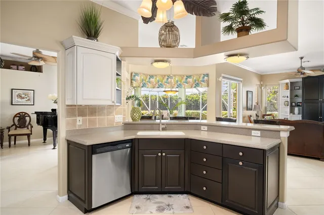 a kitchen with stainless steel appliances granite countertop a sink and a cabinets