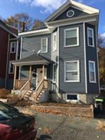 front view of a house with a small yard