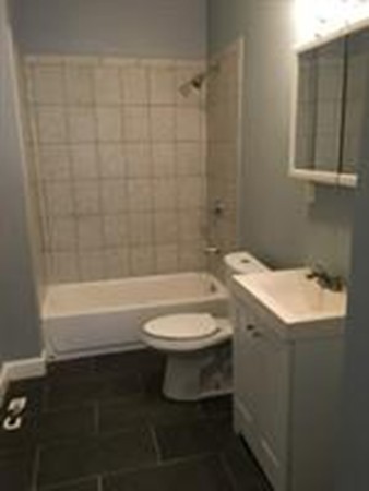 1 Proctor Street Haverhill, MA 01832 - Photo 4 of 6 a bathroom with a sink a toilet and bathtub