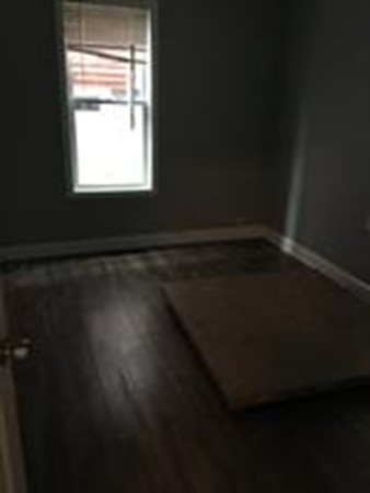 1 Proctor Street Haverhill, MA 01832 - Photo 5 of 6 a view of an empty room with wooden floor and a window