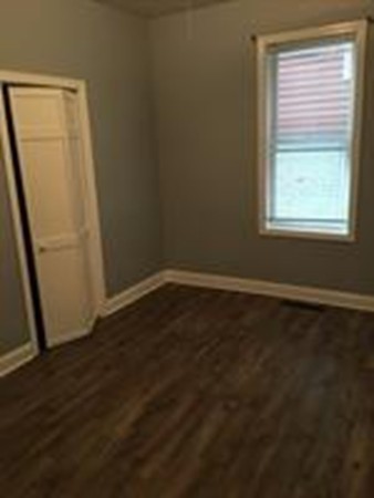1 Proctor Street Haverhill, MA 01832 - Photo 6 of 6 an empty room with wooden floor and windows