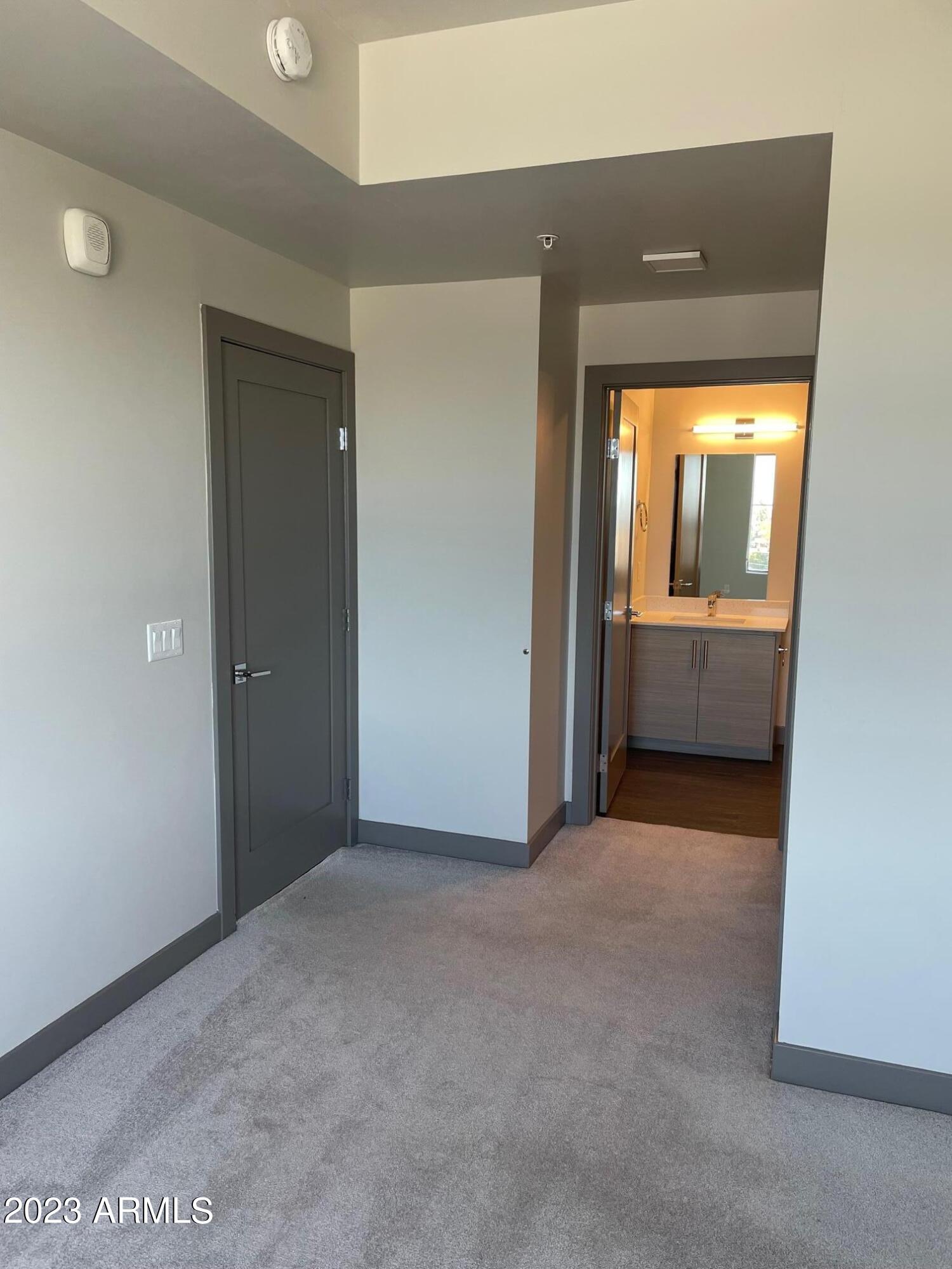 425 West Osborn Road, Unit 219 Phoenix, AZ 85013 - Photo 22 of 31 an empty room with a bathroom