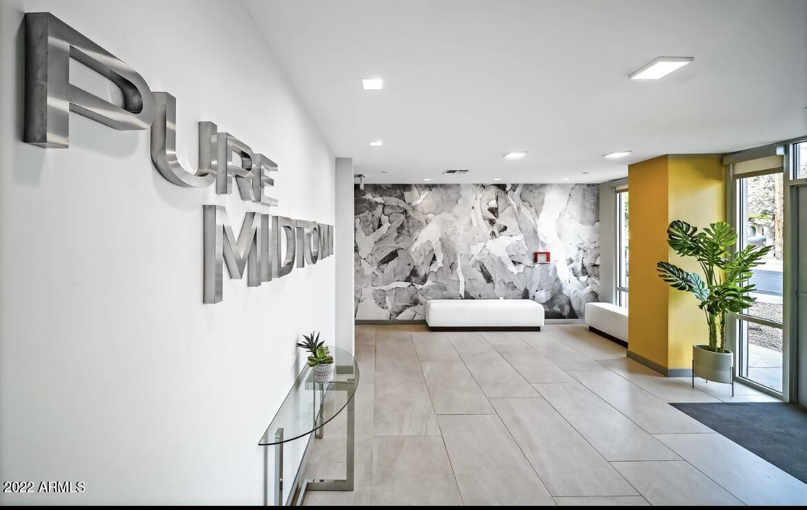425 West Osborn Road, Unit 219 Phoenix, AZ 85013 - Photo 5 of 31 a view of a livingroom with furniture and a window