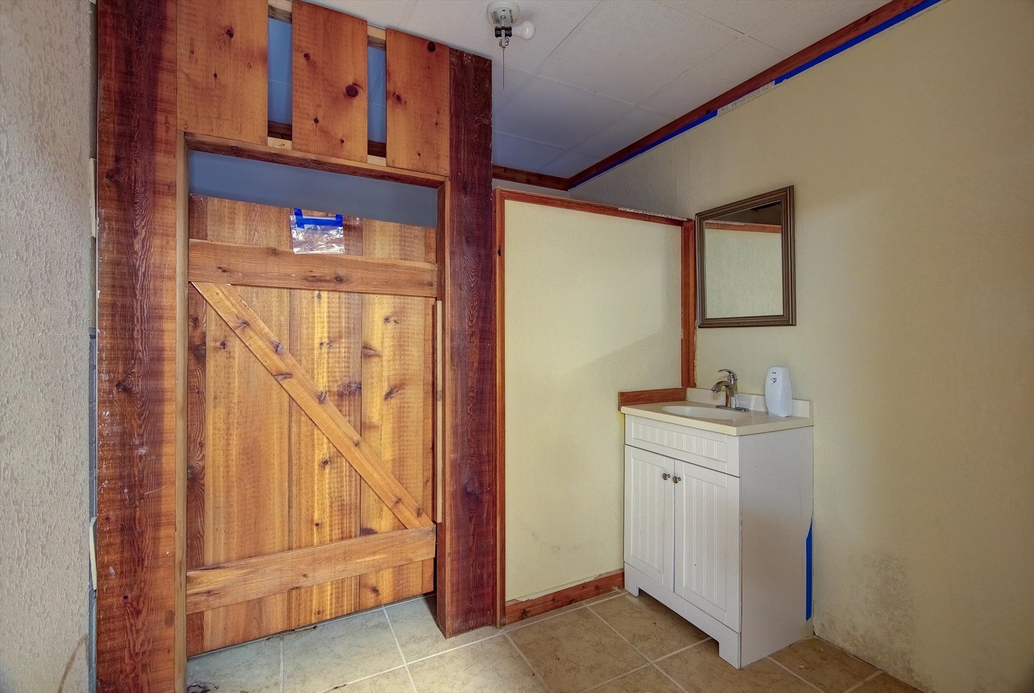 358 Demolay Street La Marque, TX 77568 - Photo 9 of 39 a bathroom with a sink and a mirror