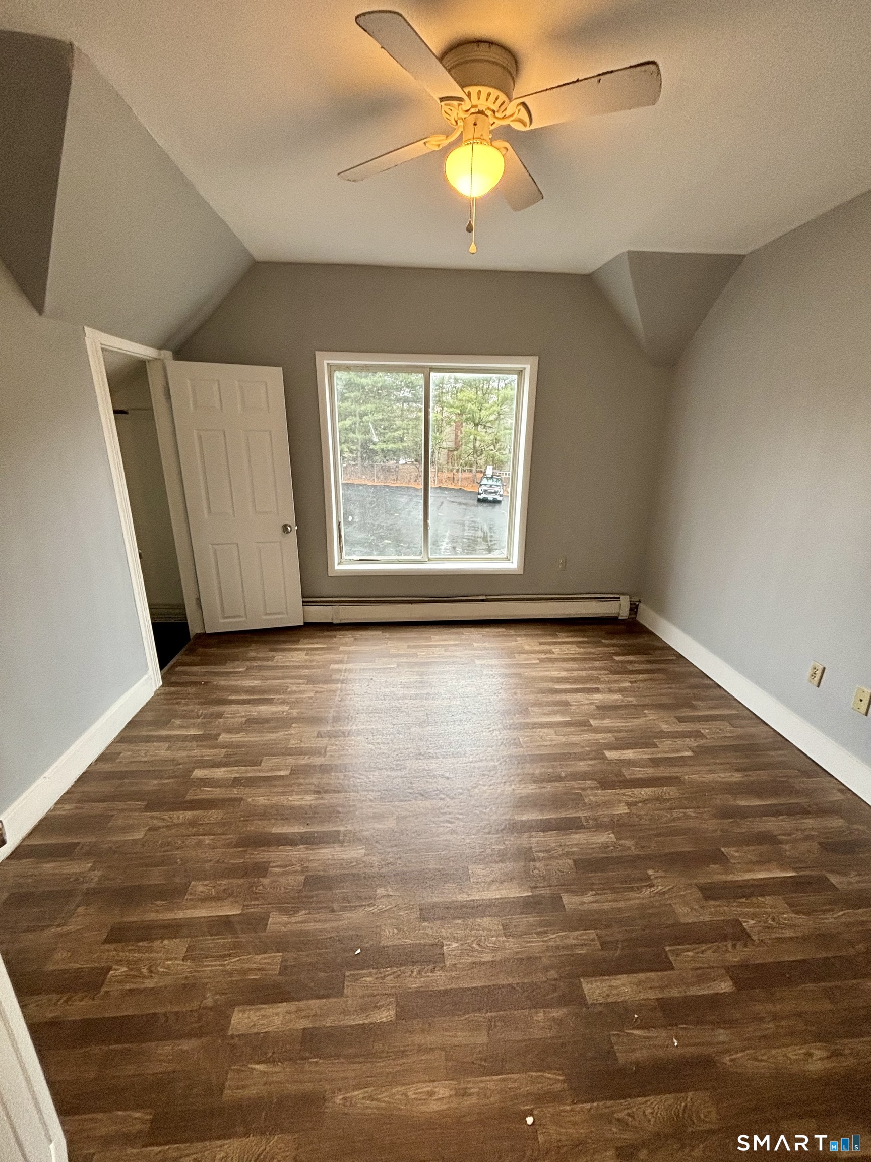 411 Main Street, Unit 1 Cromwell, CT 06416 - Photo 12 of 15 wooden floor in an empty room with a window