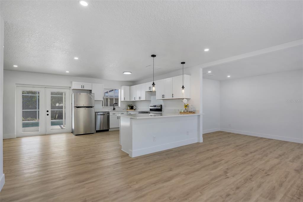 905 Spring Creek Drive Ocoee, FL 34761 - Photo 11 of 35 a view of kitchen with wooden floor