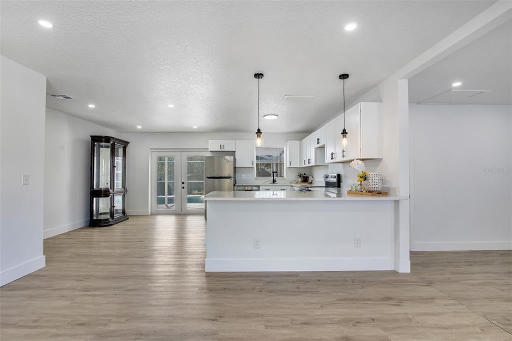 905 Spring Creek Drive Ocoee, FL 34761 - Photo 14 of 35 a view of kitchen with wooden floor