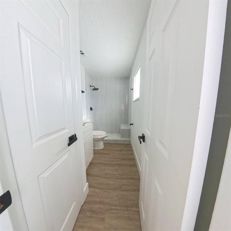 905 Spring Creek Drive Ocoee, FL 34761 - Photo 22 of 43 a view of a bathroom from the hallway