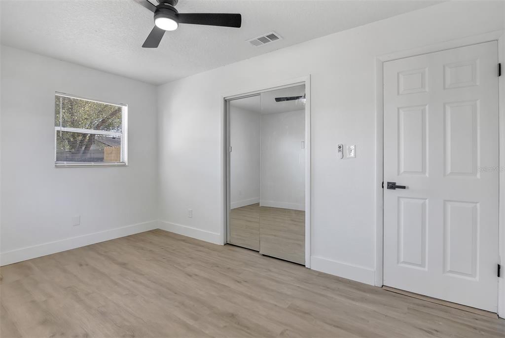 905 Spring Creek Drive Ocoee, FL 34761 - Photo 25 of 35 wooden floor in an empty room