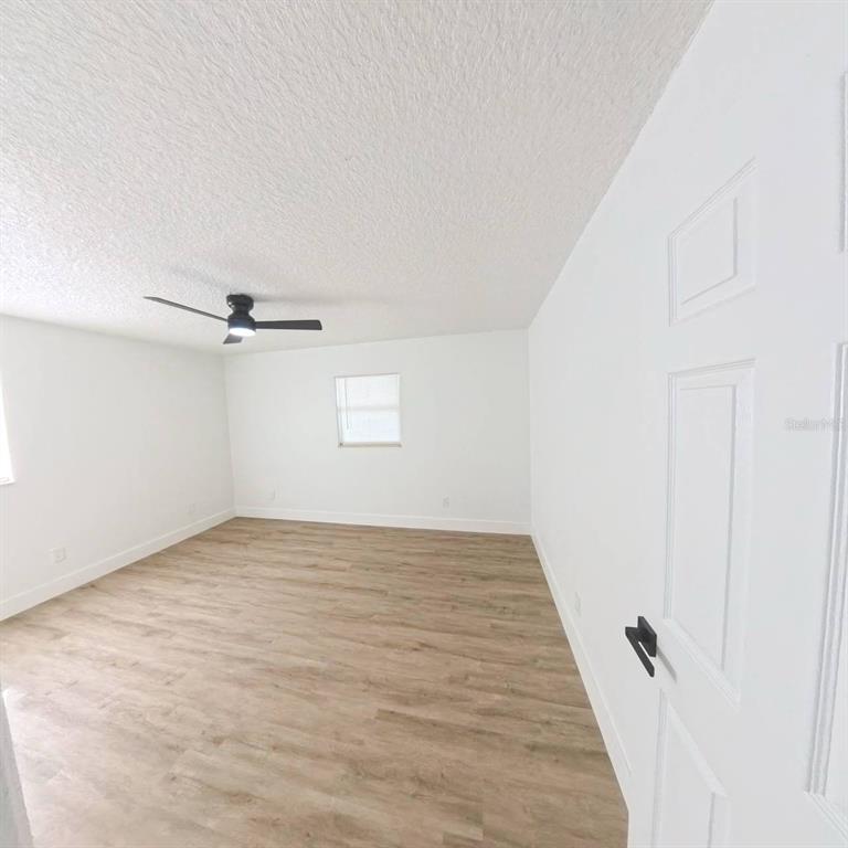 905 Spring Creek Drive Ocoee, FL 34761 - Photo 25 of 43 an empty room with a empty space and a window