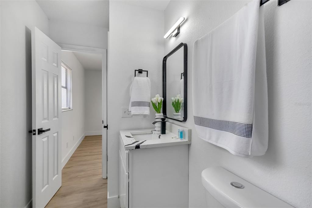 905 Spring Creek Drive Ocoee, FL 34761 - Photo 27 of 35 a bathroom with a granite countertop sink and a mirror