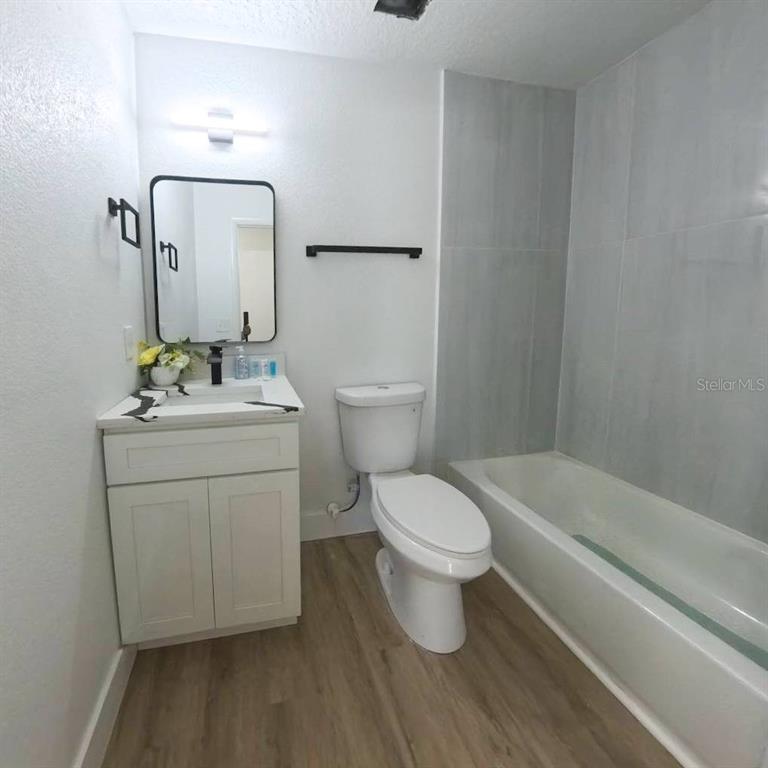 905 Spring Creek Drive Ocoee, FL 34761 - Photo 28 of 43 a white toilet sitting next to a bathroom sink