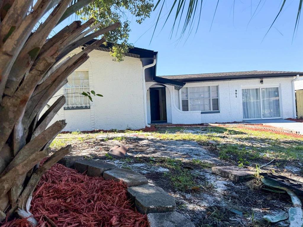 905 Spring Creek Drive Ocoee, FL 34761 - Photo 3 of 43 a view of a house with a yard