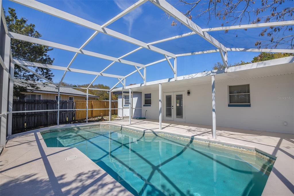 905 Spring Creek Drive Ocoee, FL 34761 - Photo 32 of 35 a view of a backyard with seating space