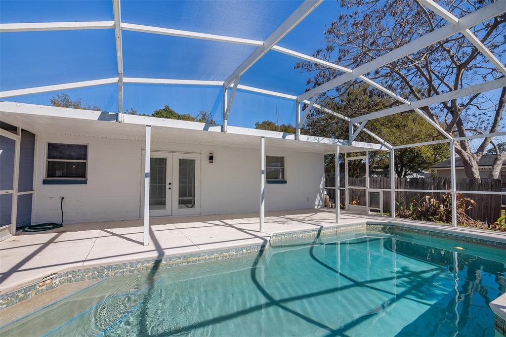 905 Spring Creek Drive Ocoee, FL 34761 - Photo 34 of 35 a house with pool in front of it