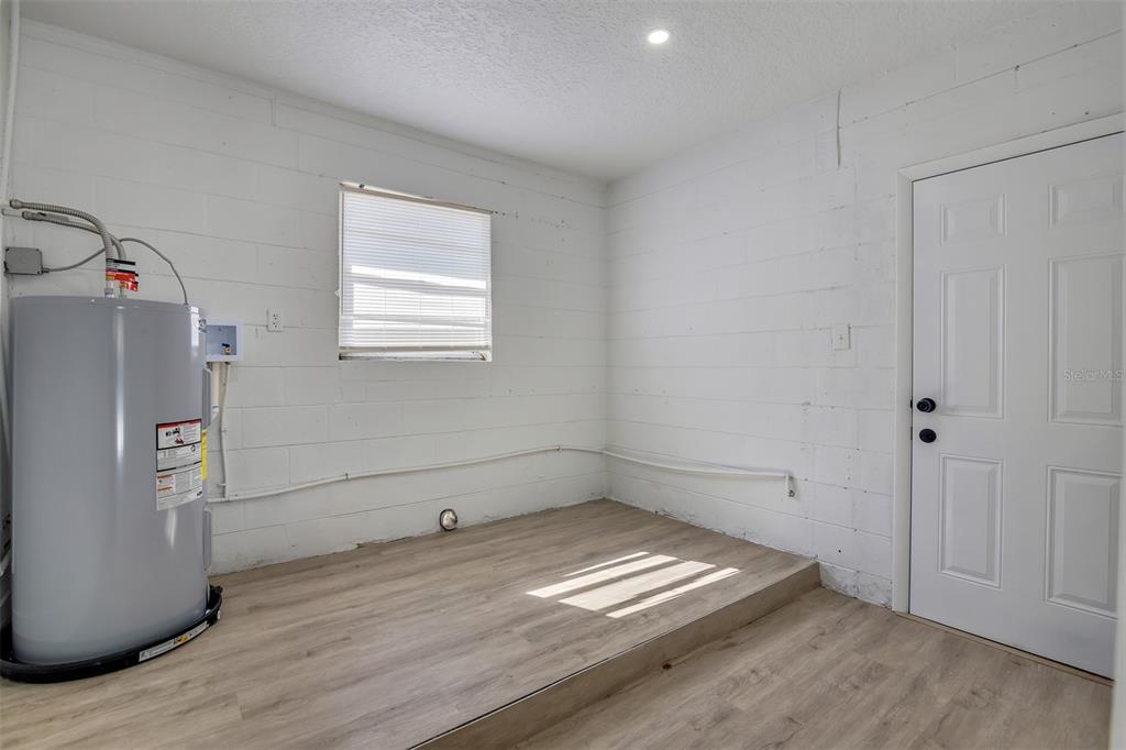 905 Spring Creek Drive Ocoee, FL 34761 - Photo 35 of 35 a view of empty room with wooden floor and cabinet