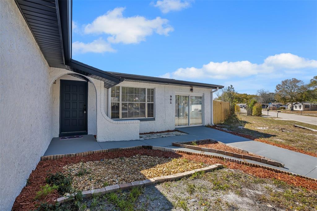 905 Spring Creek Drive Ocoee, FL 34761 - Photo 4 of 35 a view of a house with backyard