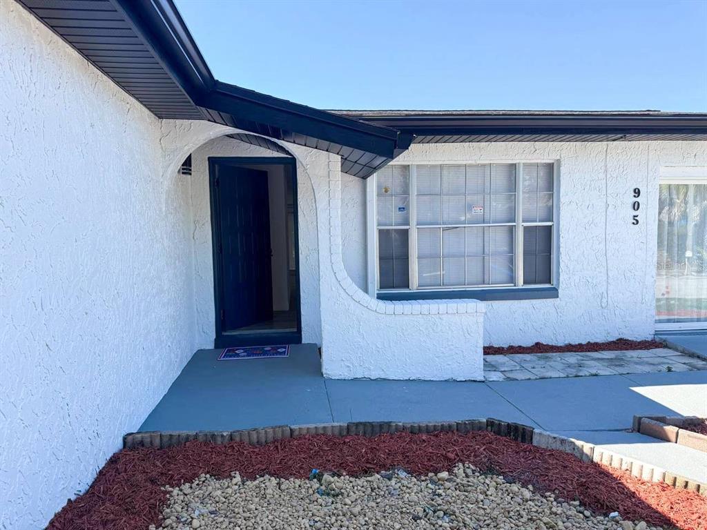 905 Spring Creek Drive Ocoee, FL 34761 - Photo 43 of 43 a view of front door of a house