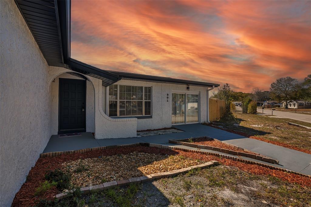 905 Spring Creek Drive Ocoee, FL 34761 - Photo 5 of 35 a view of a house with a yard