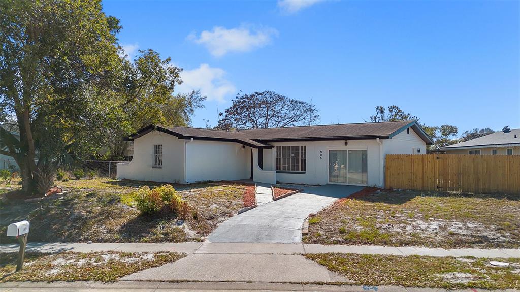 905 Spring Creek Drive Ocoee, FL 34761 - Photo 6 of 35 a view of a house with a yard
