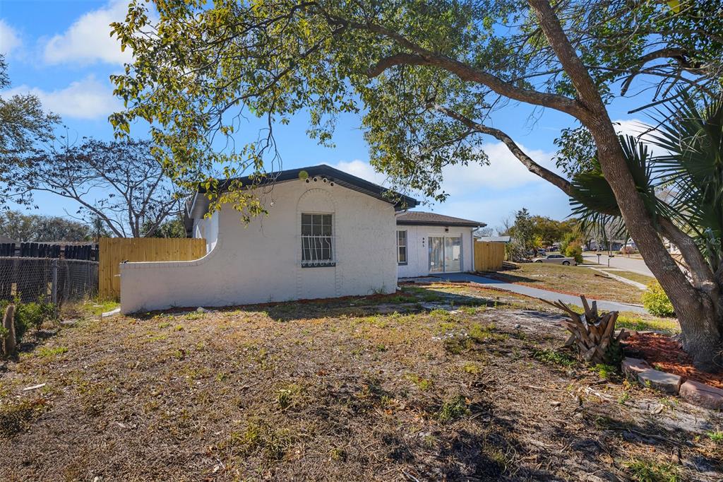 905 Spring Creek Drive Ocoee, FL 34761 - Photo 7 of 35 a house with trees in front of it