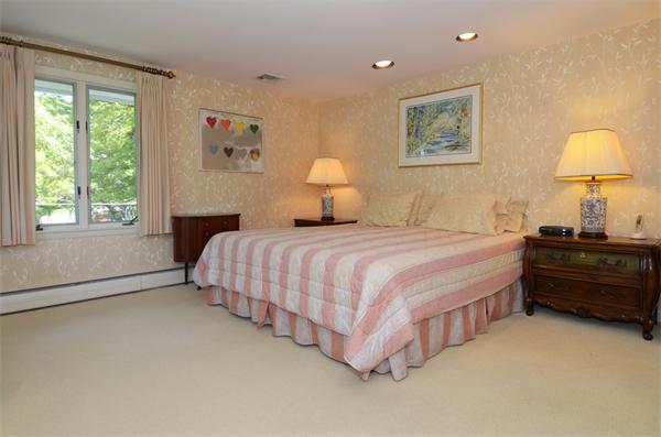 3 Driftwood Road Marblehead, MA 01945 - Photo 17 of 23 a bedroom with a bed and a lamp on dresser next to a window