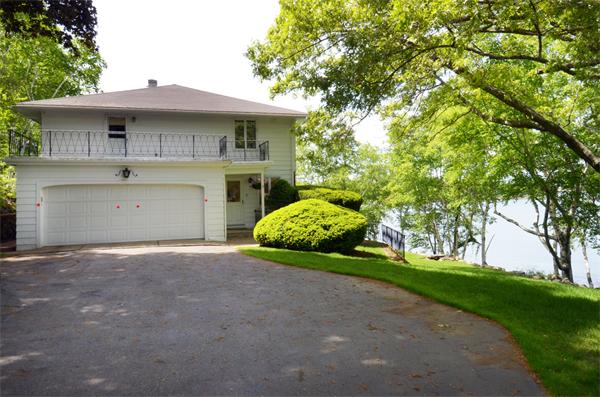 3 Driftwood Road Marblehead, MA 01945 - Photo 5 of 23 a front view of a house with a garden and yard