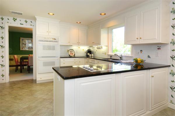 3 Driftwood Road Marblehead, MA 01945 - Photo 7 of 23 a kitchen with stainless steel appliances granite countertop a sink and cabinets