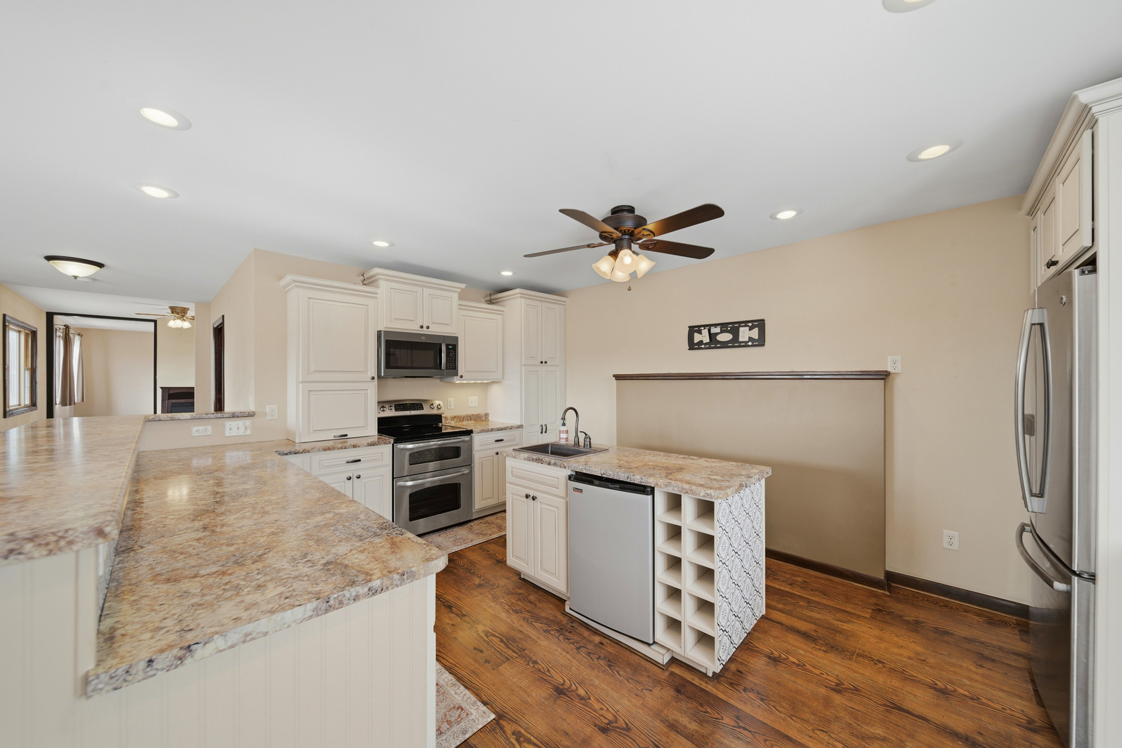 18521 Anderson Road Prophetstown, IL 61277 - Photo 14 of 39 a kitchen with a refrigerator and a stove top oven