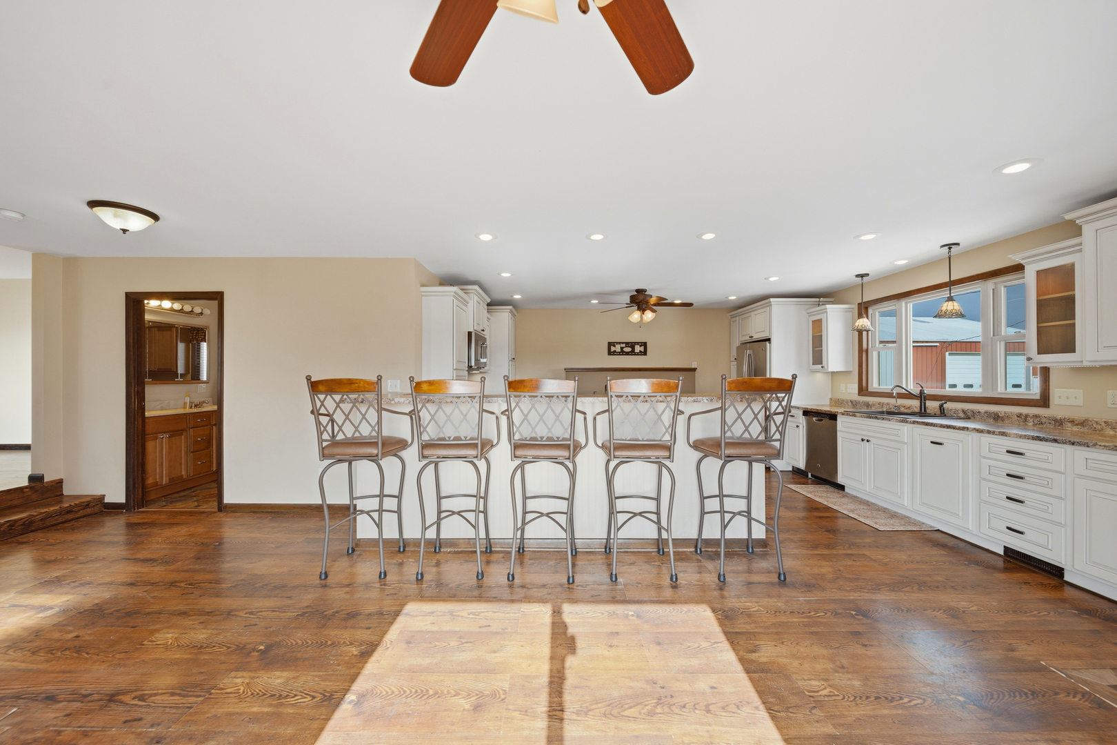 18521 Anderson Road Prophetstown, IL 61277 - Photo 18 of 39 a large kitchen with white cabinets table and chairs