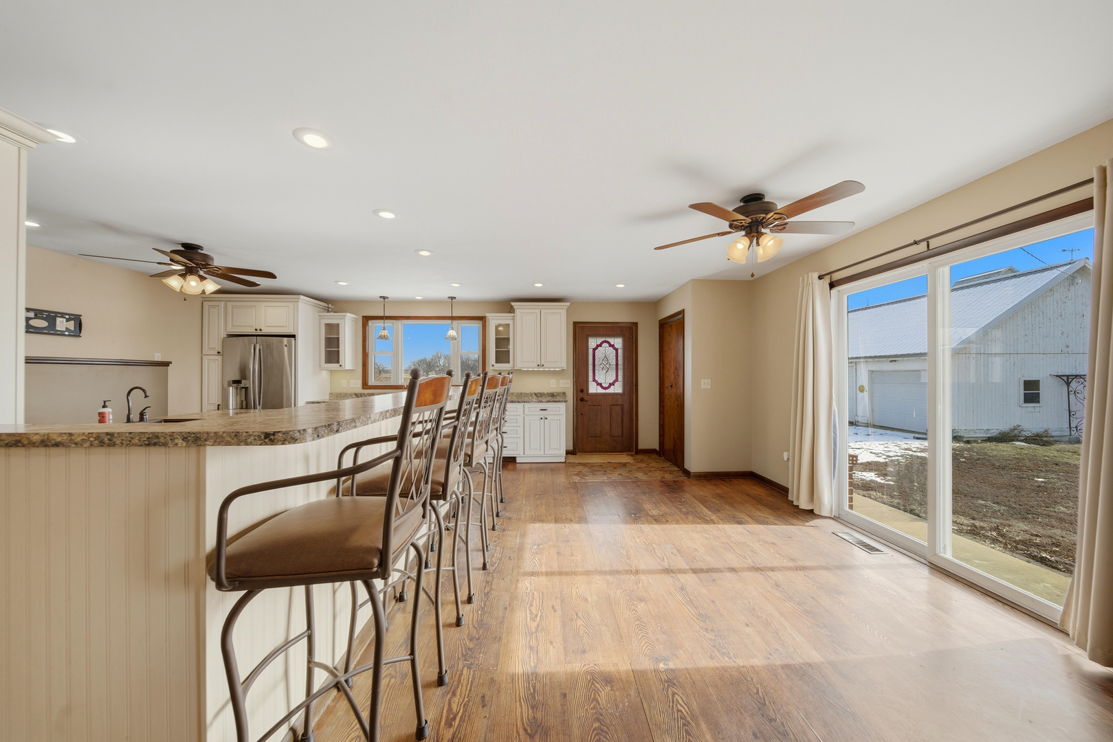 18521 Anderson Road Prophetstown, IL 61277 - Photo 19 of 39 a view of a livingroom with furniture and a ceiling fan