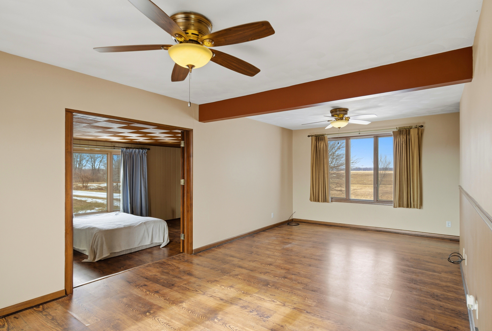 18521 Anderson Road Prophetstown, IL 61277 - Photo 25 of 39 a bedroom with a bed and a large window with wooden floor