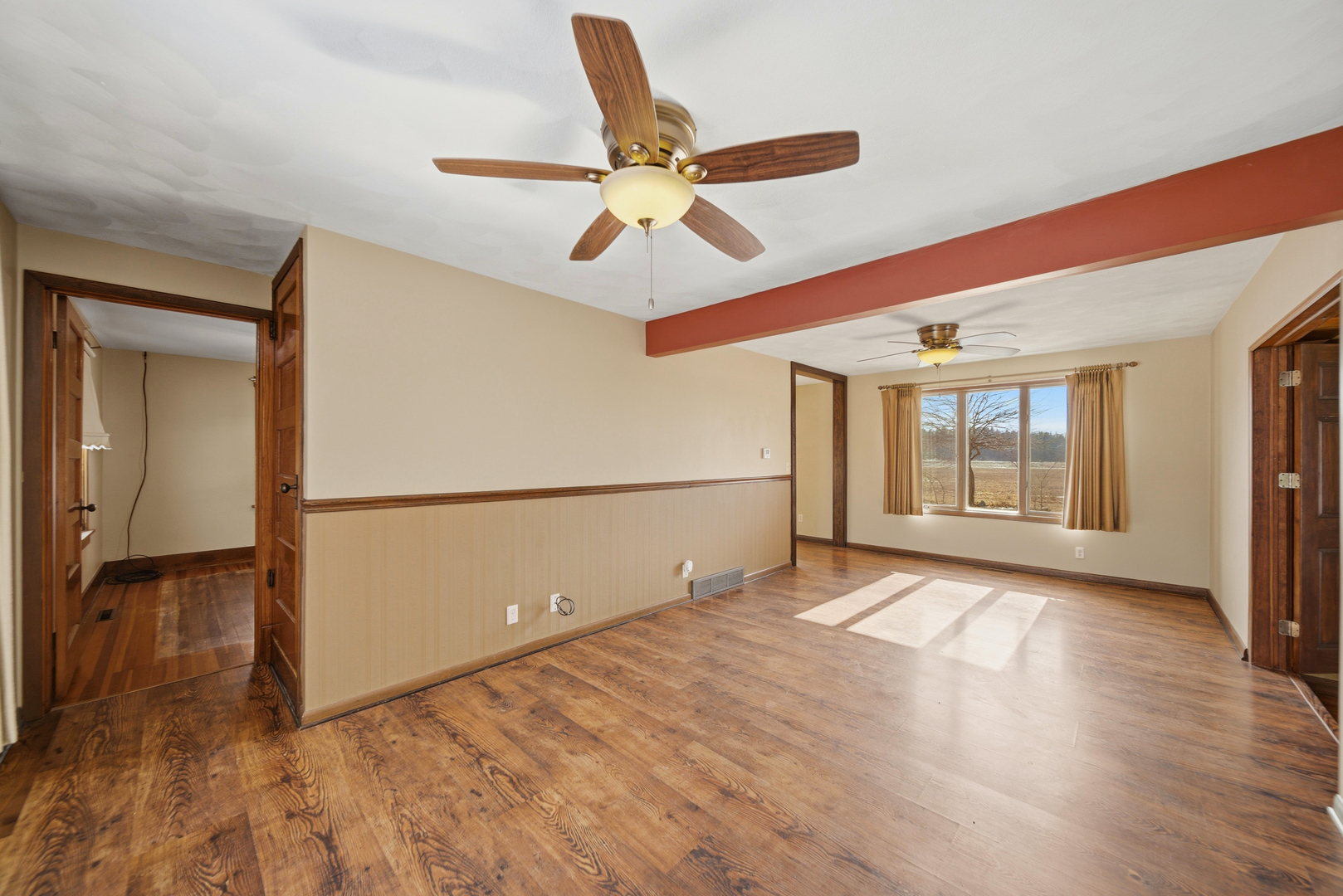 18521 Anderson Road Prophetstown, IL 61277 - Photo 27 of 39 a view of an empty room with wooden floor and a ceiling fan
