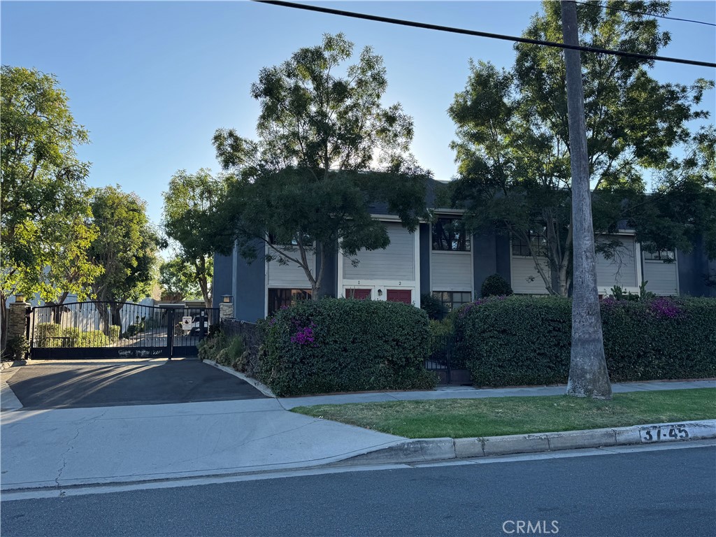 45 Harkness Avenue, Unit 2 Pasadena, CA 91106 - Photo 1 of 26 a front view of a house with a yard and garage