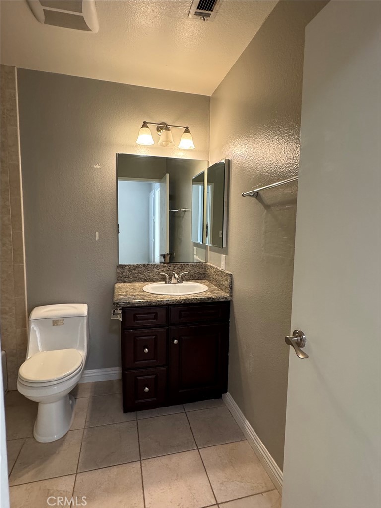 45 Harkness Avenue, Unit 2 Pasadena, CA 91106 - Photo 19 of 26 a bathroom with a toilet sink and mirror