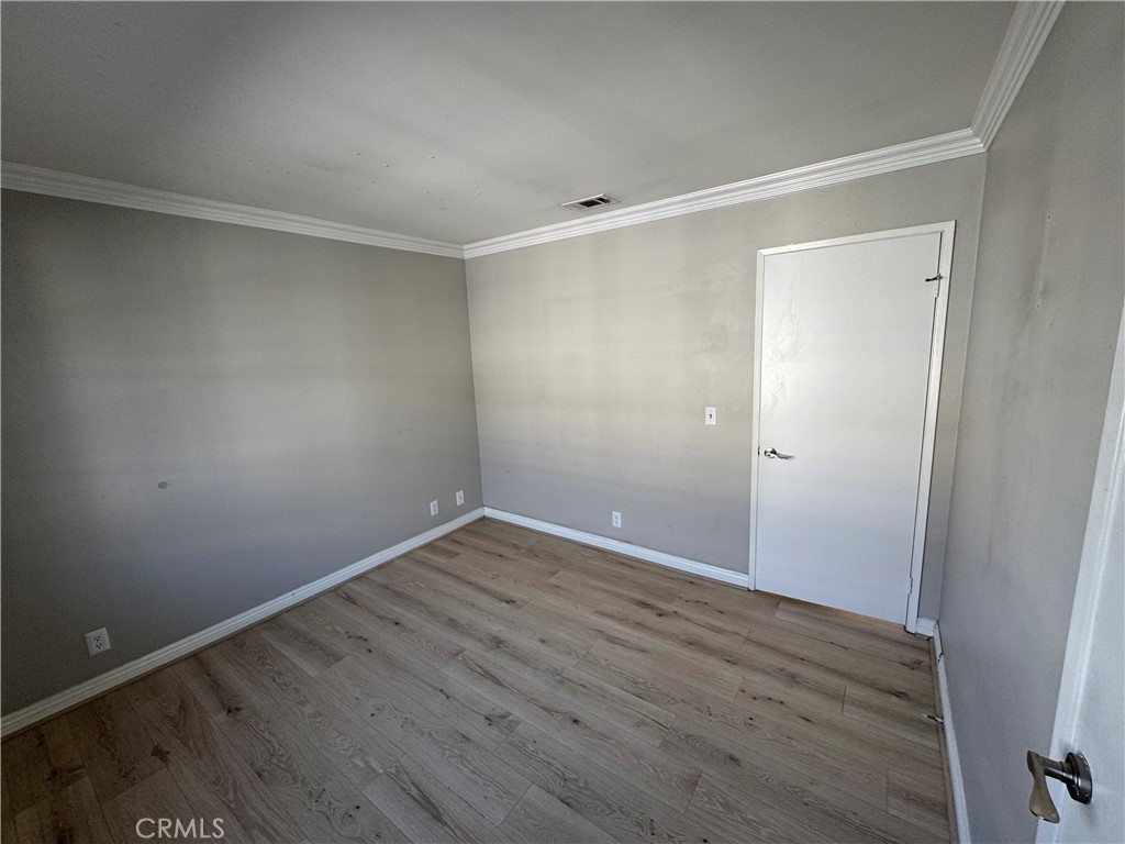 45 Harkness Avenue, Unit 2 Pasadena, CA 91106 - Photo 21 of 26 a view of an empty room with wooden floor