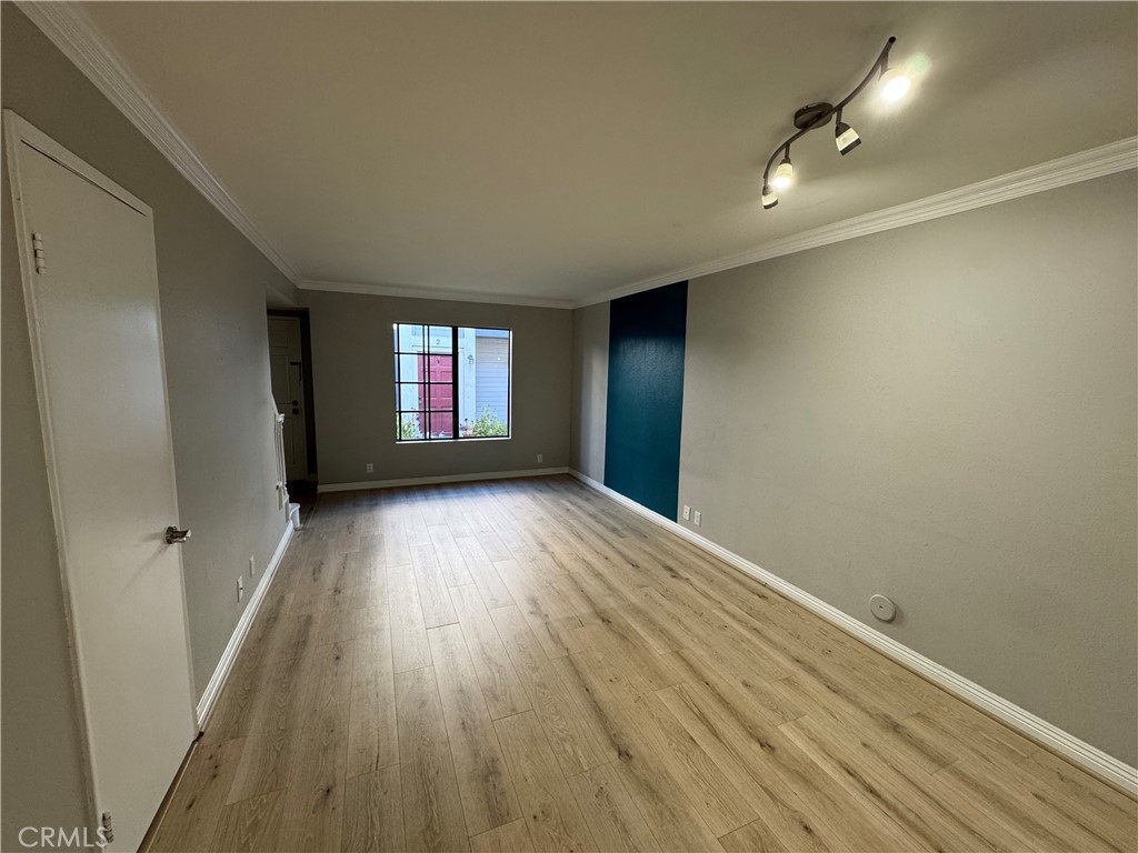 45 Harkness Avenue, Unit 2 Pasadena, CA 91106 - Photo 5 of 26 wooden floor in an empty room with a window