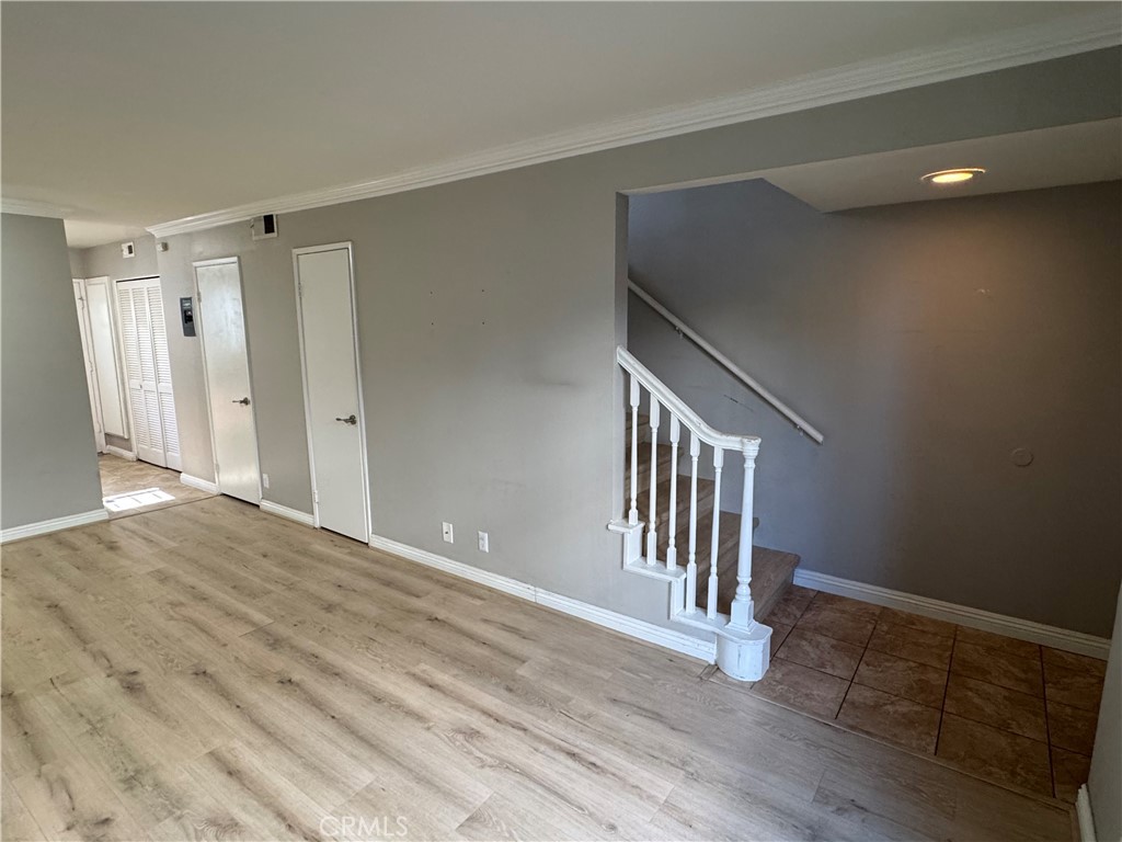 45 Harkness Avenue, Unit 2 Pasadena, CA 91106 - Photo 6 of 26 a view of an empty room with wooden floor and a window