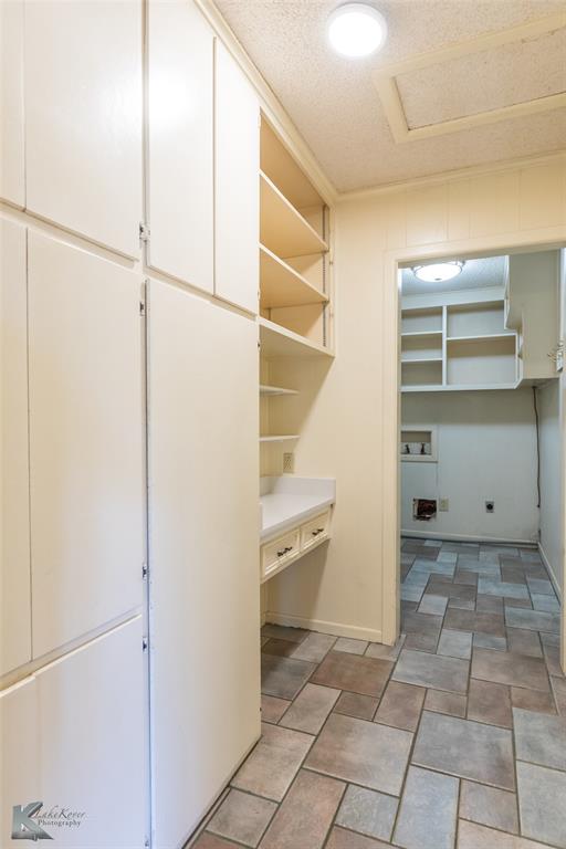 220 Hedges Road Abilene, TX 79605 - Photo 16 of 40 a view of an empty walk in closet