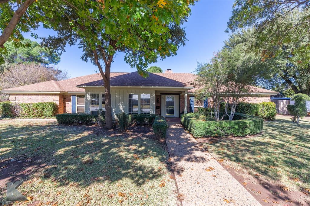 220 Hedges Road Abilene, TX 79605 - Photo 2 of 40 a front view of a house with garden