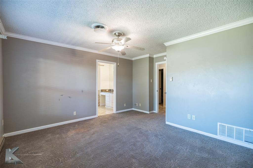 220 Hedges Road Abilene, TX 79605 - Photo 24 of 40 a view of an empty room with a ceiling fan