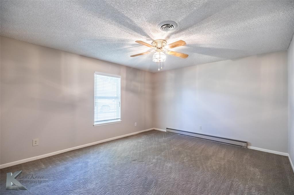 220 Hedges Road Abilene, TX 79605 - Photo 27 of 40 an empty room with windows and fan