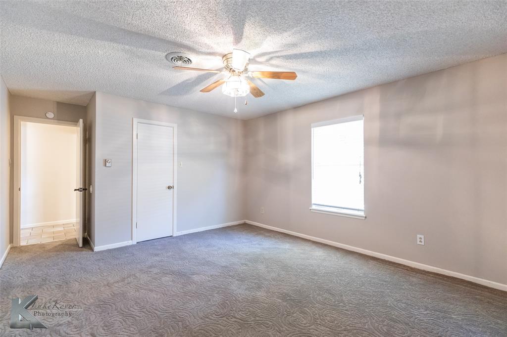 220 Hedges Road Abilene, TX 79605 - Photo 28 of 40 an empty room with windows and fan
