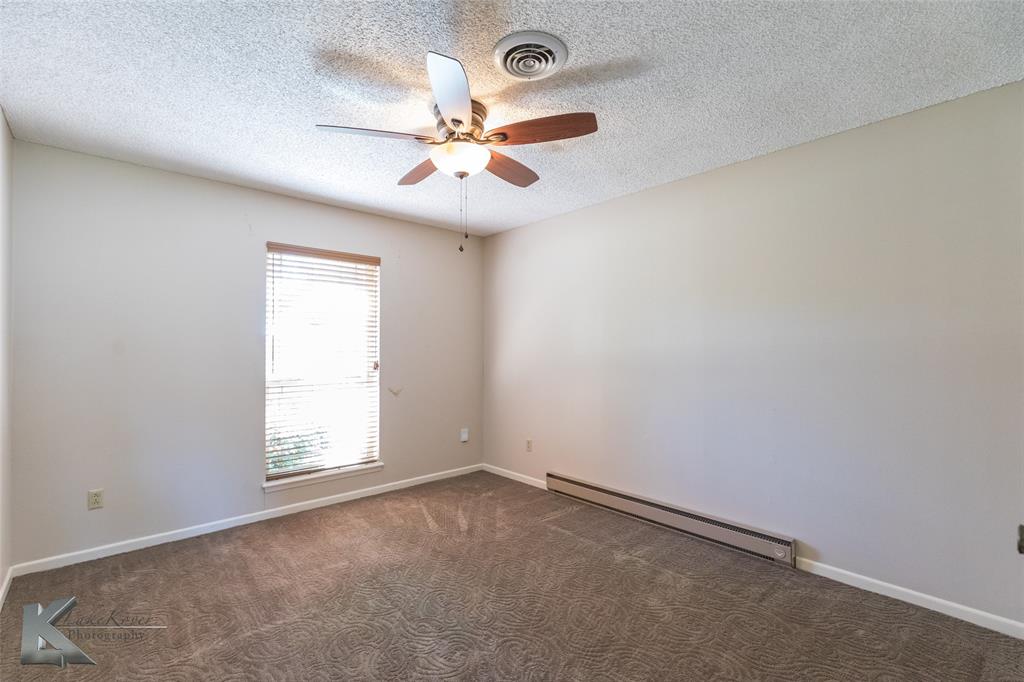 220 Hedges Road Abilene, TX 79605 - Photo 29 of 40 an empty room with windows and fan