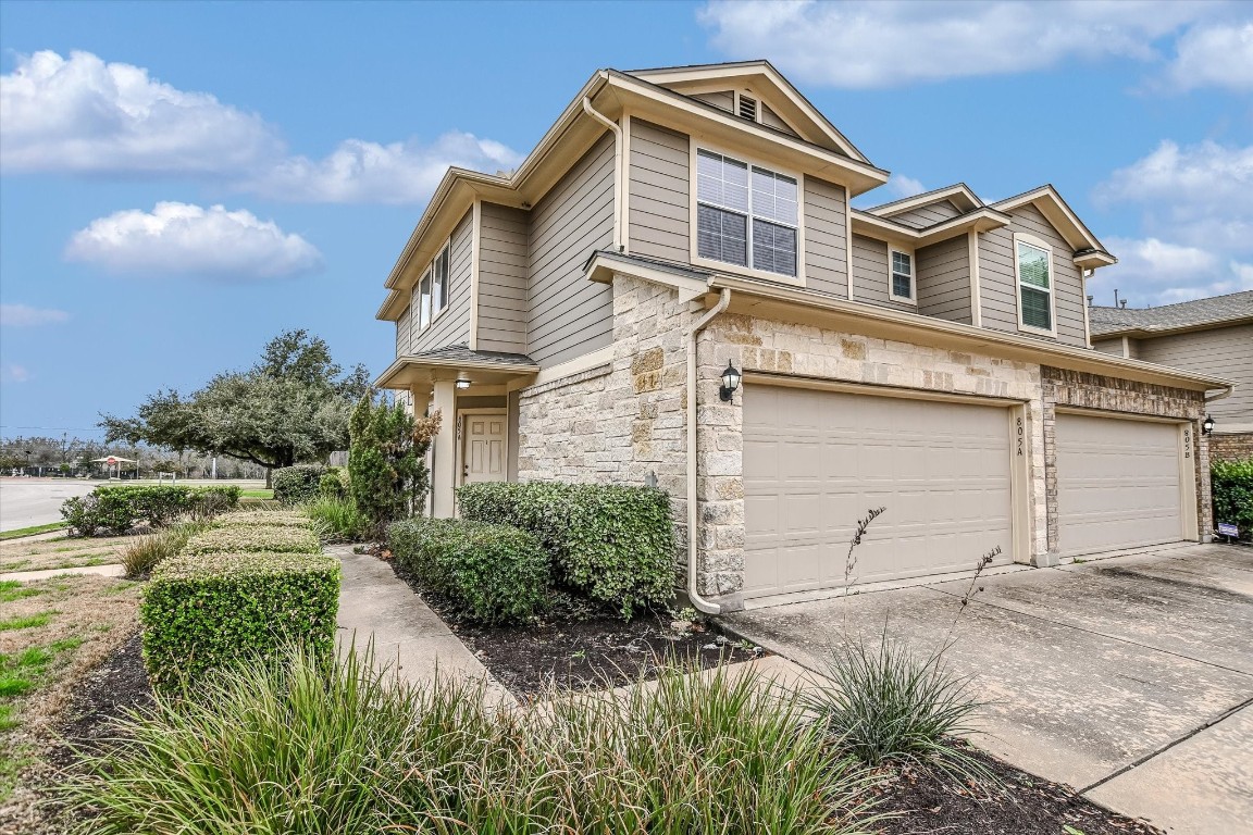 805 Jane Austen Trail, Unit A Pflugerville, TX 78660 - Photo 1 of 1 front view of a house with a yard
