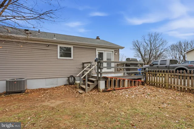 a view of a house with wooden deck