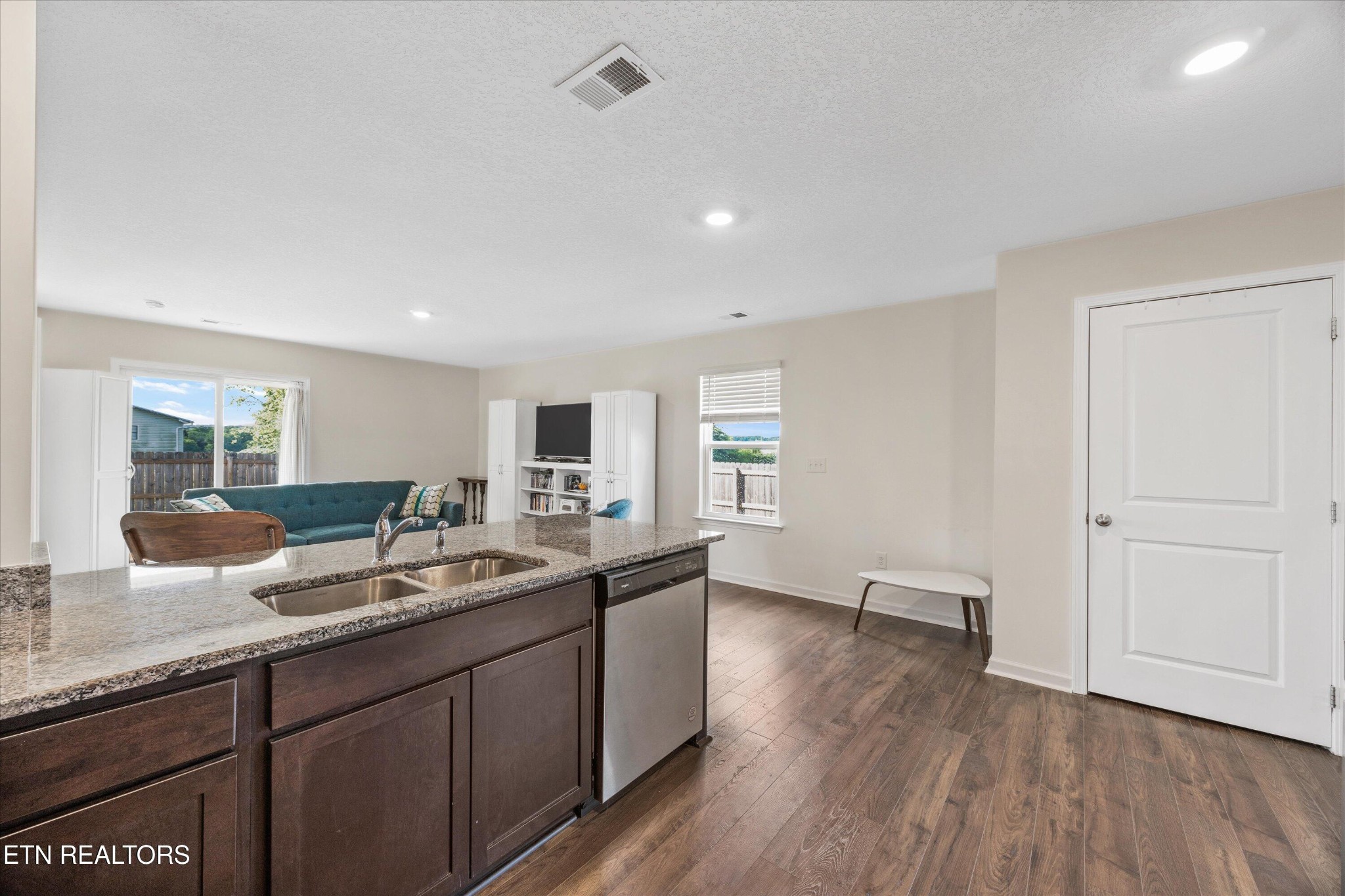 248 Belle Court Talbott, TN 37877 - Photo 12 of 36 a kitchen with a sink and wooden floor